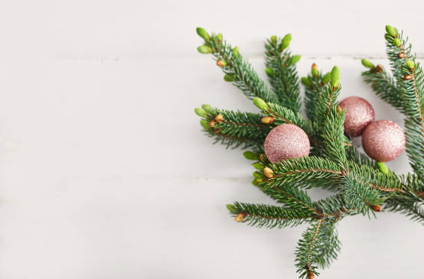 istock Christmas composition. Fir branches on wooden white background. Flat lay, top view, copy space. Christmas still life. Christmas frame made of fir branches and pink toys. Greeting card. Happy New Year 2197926326