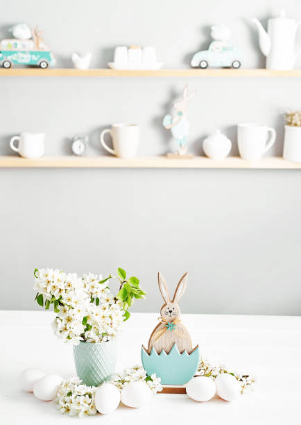 istock Easter bunny and White Easter eggs and spring branch with flowers on wooden background. Spring easter greeting card.Flowers Cherry flowering.Spring flowers. Beautiful Orchard.Springtime 2197926408