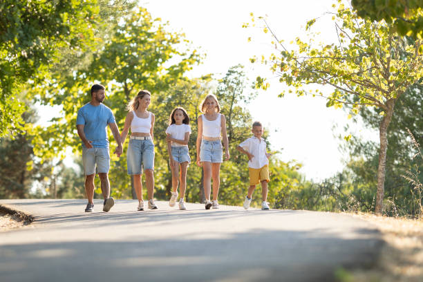 istock Happy family strolling on a sunny day 2197926704
