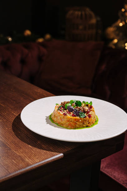 istock Culinary creation featuring vibrant dish on elegant plate in dimly lit restaurant 2197928764