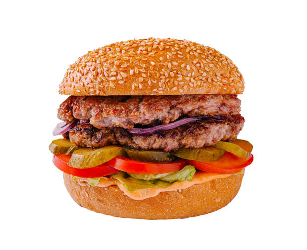 istock Delicious hamburger with fresh ingredients on a sesame seed bun served in a casual dining setting 2197928790