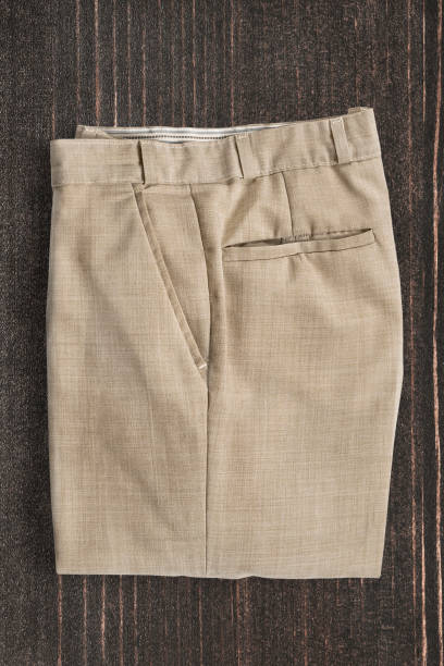 istock Pants on wooden background 2197929071