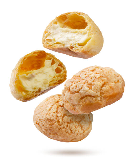 istock Cake eclairs shu and halves fly on a white background. Isolated 2197929425
