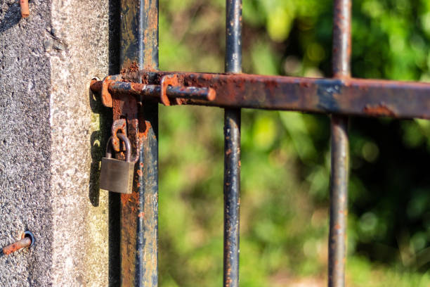 A rusty old iron door and a padlock
