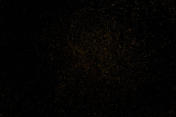 Dark concrete background with copy space. Abstract black orange textured background. Dark orange texture