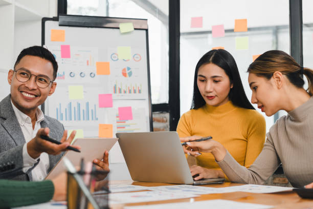 istock Collaborative business meeting with diverse professionals discussing data analysis and strategies. Engaged teamwork in modern office setting enhances productivity and creativity 2197936392