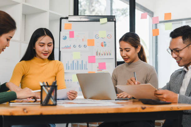 istock Collaborative team meeting with diverse professionals discussing data analysis and strategies. Engaged individuals share ideas and insights in modern workspace 2197936409