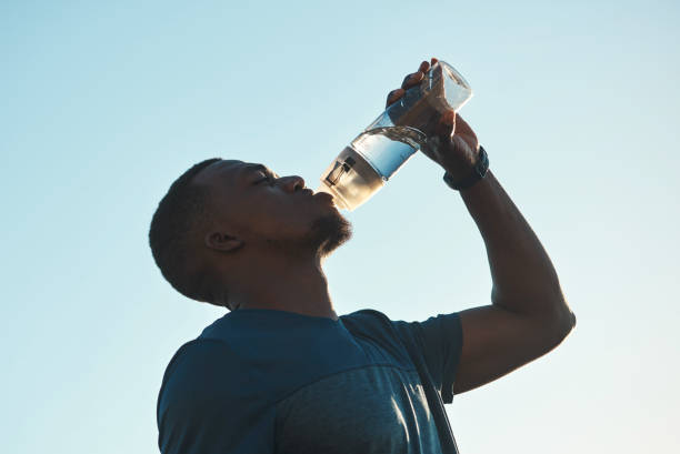 istock Young sportsman drinking refreshing water 2197936630