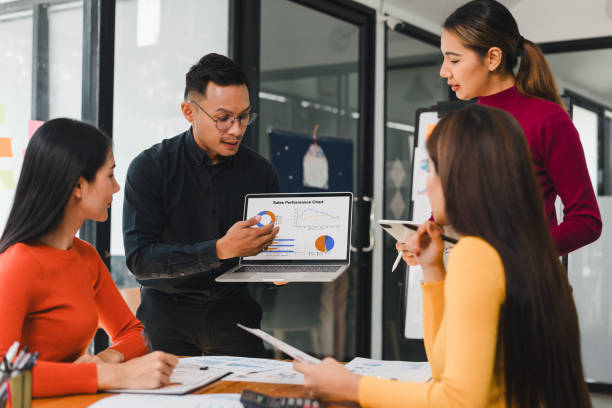 istock team discussing sales performance charts in modern office 2197936647