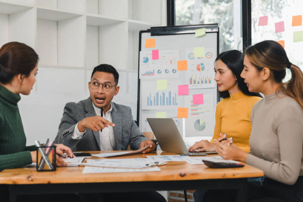 istock Team discussing business strategy with charts and graphs 2197936696