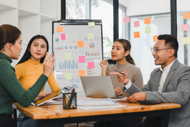 istock Team discussing business strategy with charts and sticky notes 2197936712