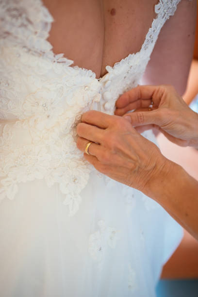 istock Wedding dress preparation with intricate detailing at a bridal setting before the ceremony 2197936794