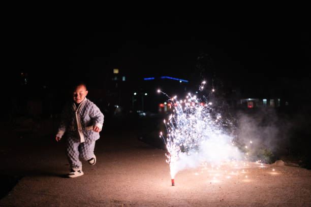 Asian children playing with fireworks