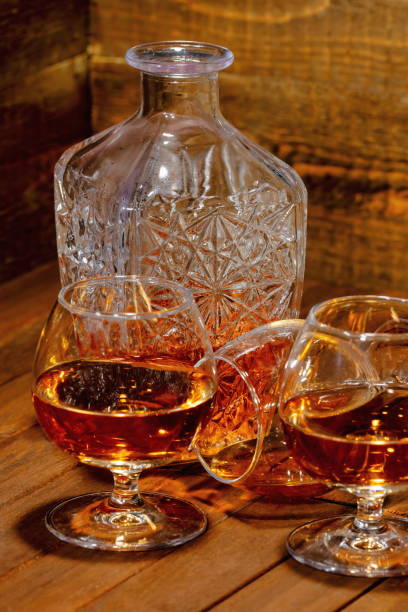 istock Cognac balloon with bottle on wooden background 2197937378