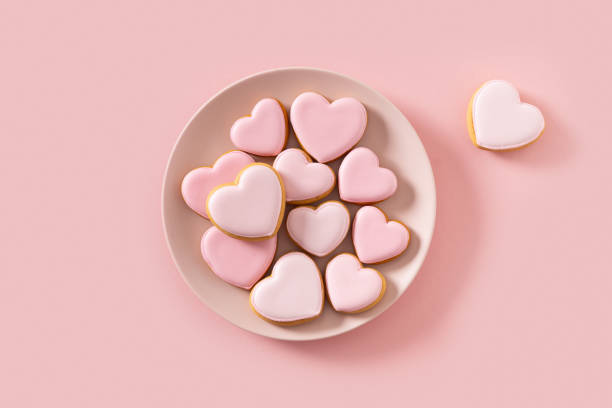 istock Valentine's Day heart shaped pink glazed cookies. 2197937545