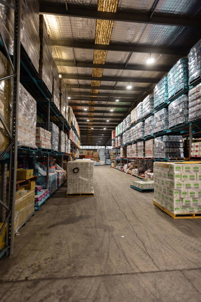istock Large Warehouse Interior with Stacked Goods and Wide Pathway 2197937962