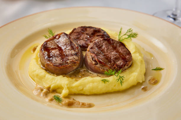 istock Elegant Veal Medallions on Creamy Mashed Potatoes with Gourmet Presentation 2197938709