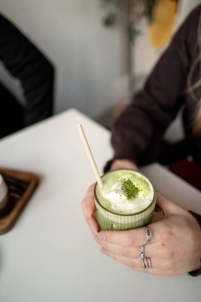 istock Enjoying a frothy matcha latte in a cafe 2197939274
