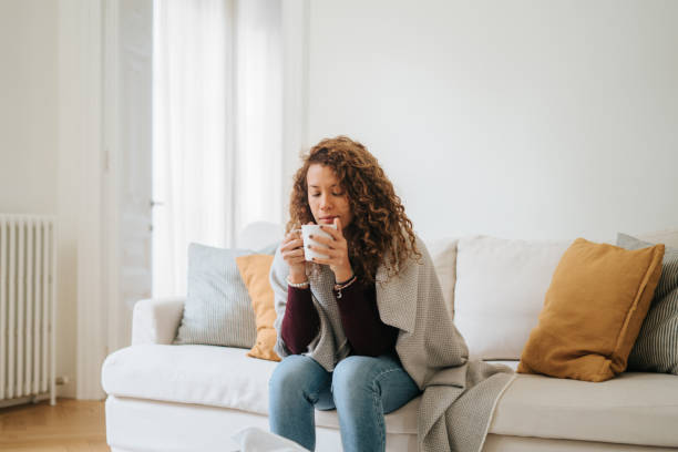 istock Woman feeling sick at home 2197941797