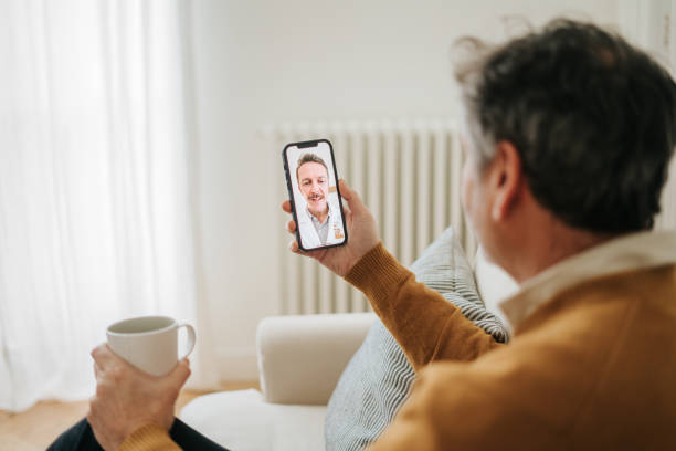 Man Having A Doctor's Appointment Online Using Smart Phone