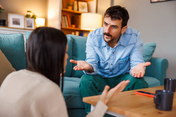 istock Couple yelling at each other while arguing at home 2197942534