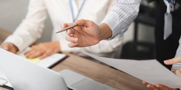 istock Business team collaboration at office desk document review professional environment close-up perspective effective communication 2197943746