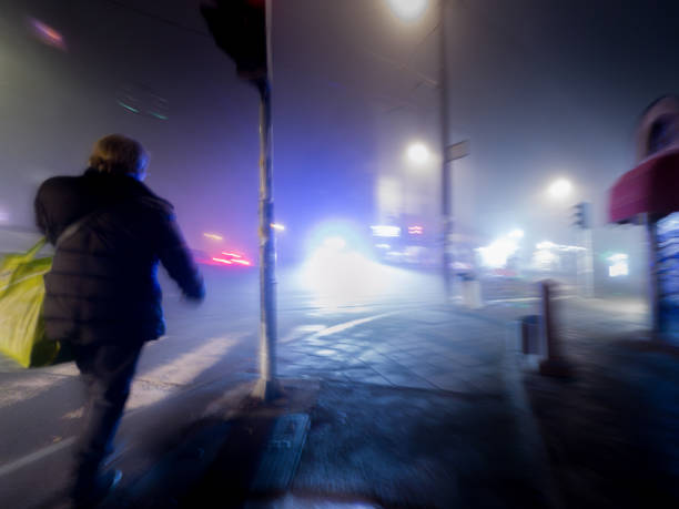 istock Blurred Motion in a Foggy Night Cityscape 2197944289