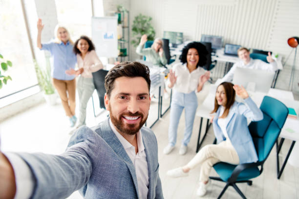 istock Professional team celebrating success together in a bright modern office environment 2197946207