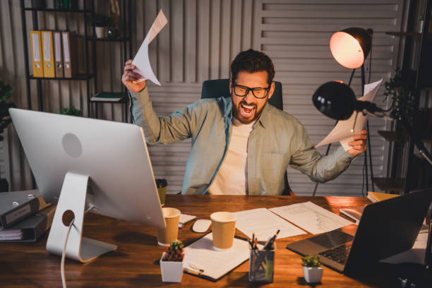 istock Young businessman reacts strongly to office work stress 2197947402