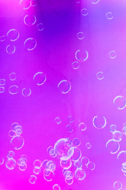 Many bubbles on a pink and purple background abstract texture