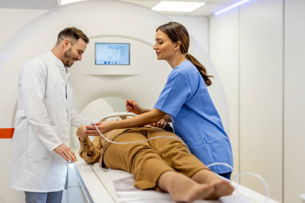istock Doctors and Nurses Assisting Patient in Modern Medical Imaging Procedure 2197950833