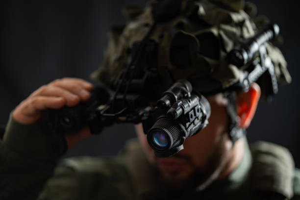 istock Modern night vision binocular mounted on a military tactical helmet. 2197953795