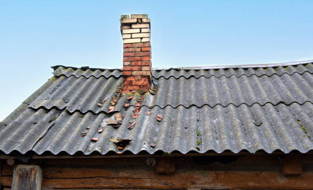 istock The brick chimney on the roof is in poor condition. 2197959996