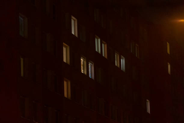 istock A blurry photo of a building with many windows lit at night 2197964725