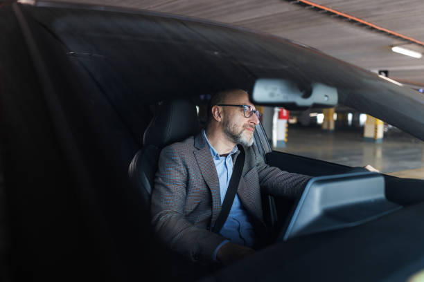 A male driver in a car