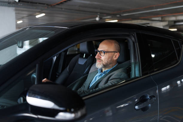 istock A mid-adult man driving a motor vehicle 2197965735