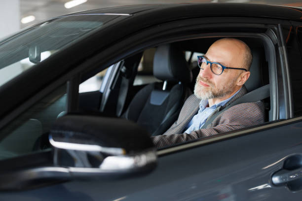 istock Stylish professional driving a modern car 2197965898