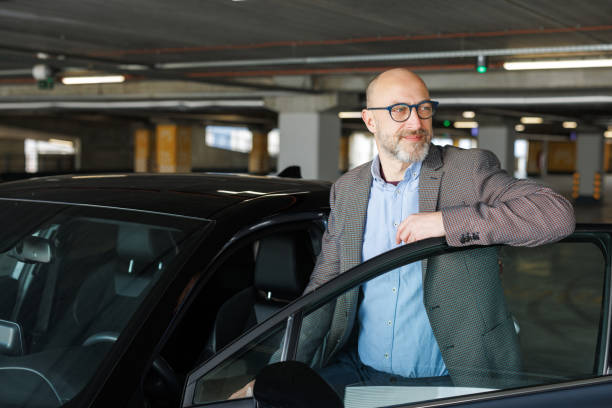 istock Business Commute: A Professional Entering His Vehicle 2197965981