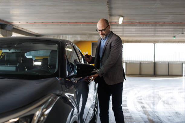 istock A businessman unlocking his car with a remote key 2197966075