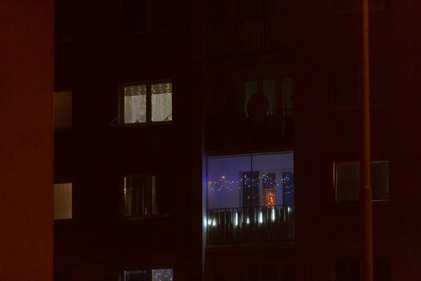 istock A tall building with many windows is beautifully illuminated at night 2197966131