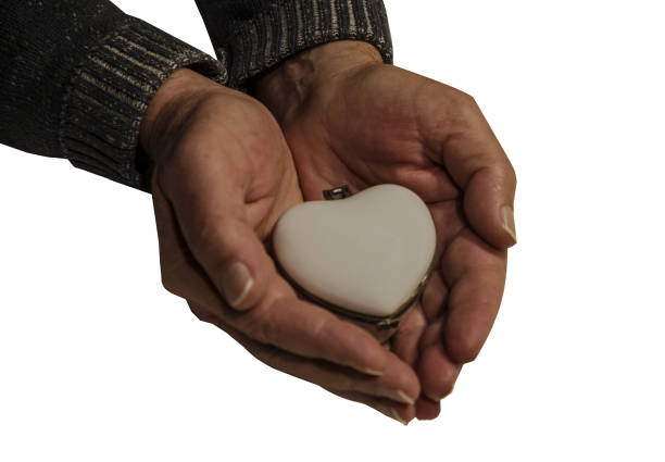 istock white porcelain heart-shaped box in male hands 2197966266