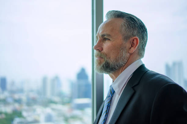 istock Businessman stand near hotel window. 2197966675