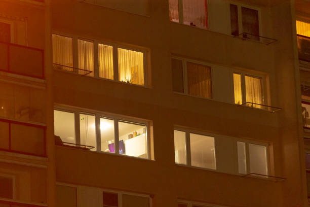 istock A large building filled with numerous windows is beautifully lit up at night 2197967362