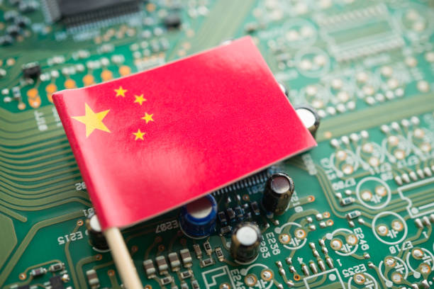 istock Chinese flag on green circuit board background. US vs China chip war or tech war, microchip semiconductor industrial competition concept. 2197967617