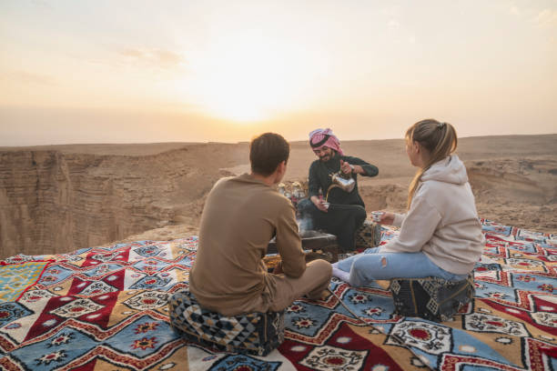 istock Saudi guide pouring tea atop Edge of the World 2197967896