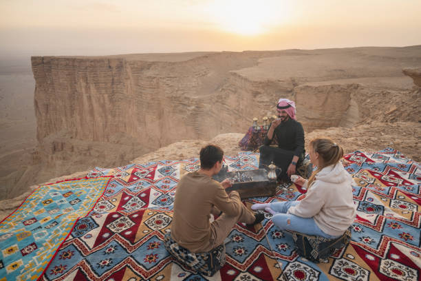 istock Hot tea and setting sun at Edge of the World, Saudi Arabia 2197967914