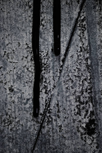 istock Abstract Painting with Drops of Black Paint Flowing down Fabric Surface with Cloth Texture 2197972525