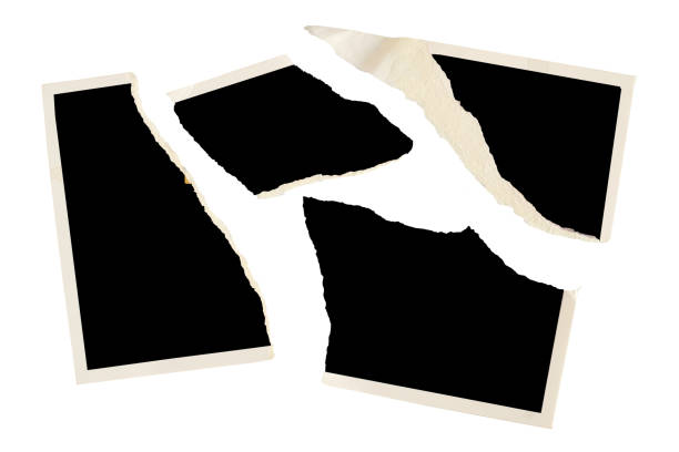 istock Torn old blank photograph, picture frame, divorce, contradiction concept for instance,isolated on white 2197972592