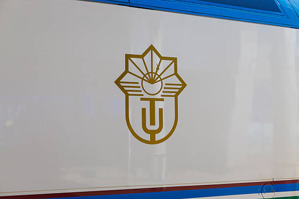 Tashkent, Uzbekistan - 29 September 2024: golden emblem of Uzbekistan Railways on a train carriage