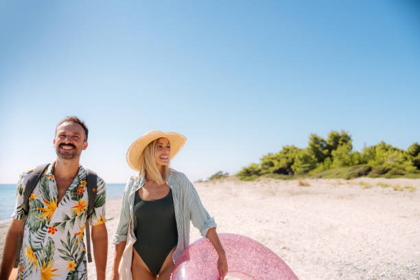 istock Couple having a fun day at the beach 2197983899